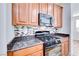 Modern kitchen features gas range and microwave at 7683 Jasmine Falls Dr, Las Vegas, NV 89179