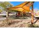 Community playground with shade structure and play equipment at 7683 Jasmine Falls Dr, Las Vegas, NV 89179