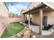 Backyard with covered patio, putting green, and Japanese bridge at 7879 Narnia Ave, Las Vegas, NV 89113