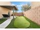 Backyard featuring a putting green and covered patio area at 7879 Narnia Ave, Las Vegas, NV 89113