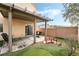 Covered patio, putting green and a small Japanese bridge in backyard at 7879 Narnia Ave, Las Vegas, NV 89113