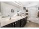 Bathroom with double vanity and shower/tub combo at 7879 Narnia Ave, Las Vegas, NV 89113