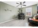 Bright bedroom with desk and window seating at 7879 Narnia Ave, Las Vegas, NV 89113