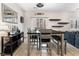 Dining area with gray table and bench near kitchen at 7879 Narnia Ave, Las Vegas, NV 89113