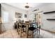 Dining area with gray table, bench and access to backyard at 7879 Narnia Ave, Las Vegas, NV 89113