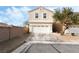 Two-story house with attached garage and landscaped front yard at 7879 Narnia Ave, Las Vegas, NV 89113