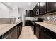 Spacious kitchen featuring stainless steel appliances and granite countertops at 7879 Narnia Ave, Las Vegas, NV 89113