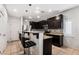 Modern kitchen with stainless steel appliances and dark cabinetry at 7879 Narnia Ave, Las Vegas, NV 89113