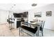 Kitchen with dark cabinets, an island and tile flooring at 7879 Narnia Ave, Las Vegas, NV 89113