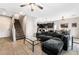 Living room with sectional sofa, coffee table and staircase at 7879 Narnia Ave, Las Vegas, NV 89113