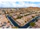 Aerial view of a residential neighborhood with houses and landscaping at 7976 Sleeping Lily Dr, Las Vegas, NV 89178