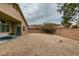 Backyard with gravel, a covered patio and seating area at 7976 Sleeping Lily Dr, Las Vegas, NV 89178