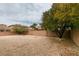 Large backyard with gravel and mature trees at 7976 Sleeping Lily Dr, Las Vegas, NV 89178