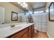 Bathroom with double sinks, a shower/tub combo and tile floor at 7976 Sleeping Lily Dr, Las Vegas, NV 89178