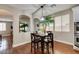 Kitchen breakfast nook with a dark wood table and chairs at 7976 Sleeping Lily Dr, Las Vegas, NV 89178