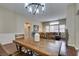 Bright dining room with hardwood floors and a rustic wooden table at 7976 Sleeping Lily Dr, Las Vegas, NV 89178