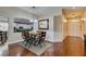 Hardwood floors, chandelier, and view of the kitchen at 7976 Sleeping Lily Dr, Las Vegas, NV 89178