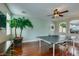 Bright game room with ping pong table and hardwood floors at 7976 Sleeping Lily Dr, Las Vegas, NV 89178