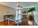 Game room with ping pong table, hardwood floors, and ceiling fan at 7976 Sleeping Lily Dr, Las Vegas, NV 89178