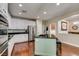 Modern kitchen featuring white cabinets, granite countertops, and stainless steel appliances at 7976 Sleeping Lily Dr, Las Vegas, NV 89178