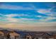 Aerial view of neighborhood with distant city skyline at 816 Loch Katrine Ave, Henderson, NV 89012