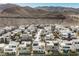 Aerial view of a row of modern homes in a desert environment at 816 Loch Katrine Ave, Henderson, NV 89012