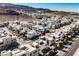 Aerial view of a community of modern homes nestled in a mountainous region at 816 Loch Katrine Ave, Henderson, NV 89012