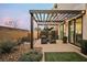 Landscaped backyard with pergola and patio at 816 Loch Katrine Ave, Henderson, NV 89012