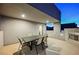 Covered balcony with outdoor fireplace and seating at 816 Loch Katrine Ave, Henderson, NV 89012