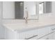 Bathroom vanity with white cabinets and quartz countertop at 816 Loch Katrine Ave, Henderson, NV 89012