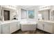 Bathroom with corner soaking tub and double vanity at 816 Loch Katrine Ave, Henderson, NV 89012