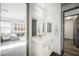 Modern bathroom with white vanity, quartz countertop, and mirror at 816 Loch Katrine Ave, Henderson, NV 89012