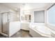 Bathroom with soaking tub, shower, and double vanity at 816 Loch Katrine Ave, Henderson, NV 89012