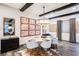 Elegant dining room with marble table and modern chandelier at 816 Loch Katrine Ave, Henderson, NV 89012