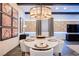 Modern dining room with marble table and statement lighting at 816 Loch Katrine Ave, Henderson, NV 89012