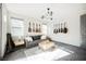 Game room with gray sofa, coffee table, and guitars on the wall at 816 Loch Katrine Ave, Henderson, NV 89012