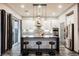 Modern kitchen with island, stainless steel appliances, and gray cabinetry at 816 Loch Katrine Ave, Henderson, NV 89012