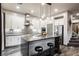 Modern kitchen with island and stainless steel appliances at 816 Loch Katrine Ave, Henderson, NV 89012