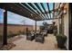 Relaxing patio with pergola, seating, and grill at 816 Loch Katrine Ave, Henderson, NV 89012