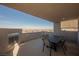 Private rooftop patio with city views and a built-in fireplace at 816 Loch Katrine Ave, Henderson, NV 89012