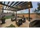 Cozy patio with pergola, seating, and grill at 816 Loch Katrine Ave, Henderson, NV 89012