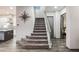 Modern carpeted staircase with metal railing at 816 Loch Katrine Ave, Henderson, NV 89012