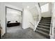 Upper hallway with carpet, leading to bedroom and staircase at 816 Loch Katrine Ave, Henderson, NV 89012