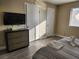 Bedroom with a comfortable bed and plenty of closet space at 8233 Ducharme Ave, Las Vegas, NV 89145