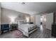 Spacious bedroom with a comfortable bed and en-suite bathroom at 8233 Ducharme Ave, Las Vegas, NV 89145