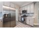 Stainless steel appliances and gray cabinets in this updated kitchen at 8233 Ducharme Ave, Las Vegas, NV 89145