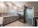 Modern kitchen with stainless steel appliances and gray cabinets at 8233 Ducharme Ave, Las Vegas, NV 89145