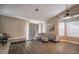 Living room with sectional sofa and sliding glass door at 8233 Ducharme Ave, Las Vegas, NV 89145