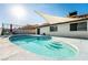 Refreshing kidney-shaped pool, shaded patio area at 8233 Ducharme Ave, Las Vegas, NV 89145