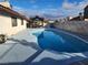 Serene kidney-shaped pool and patio area at 8233 Ducharme Ave, Las Vegas, NV 89145